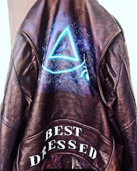a leather jacket with the words best dressed on it